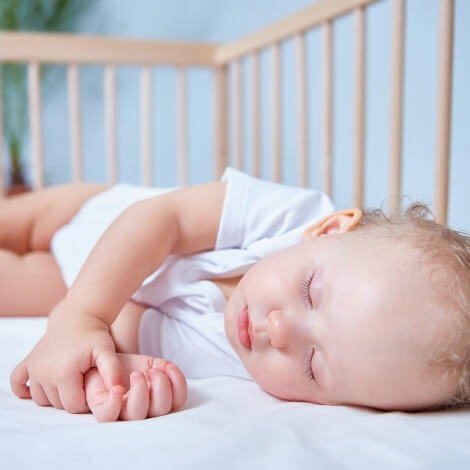 Sleeping baby in crib